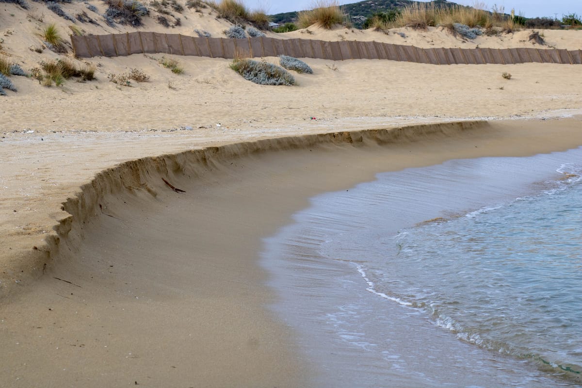 The white sand and the shallows of Ammolofi beach west of Nea Peramos