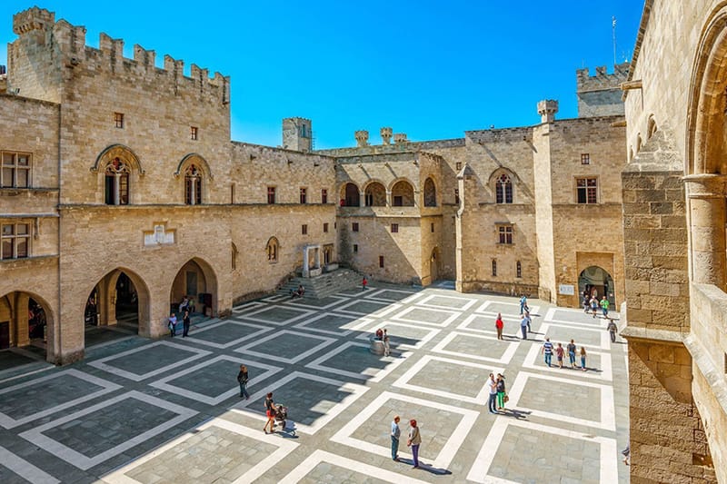 The courtyard of the Palace of the Grand Masters in Rhodes Old Town, with its arcades and chequered paving