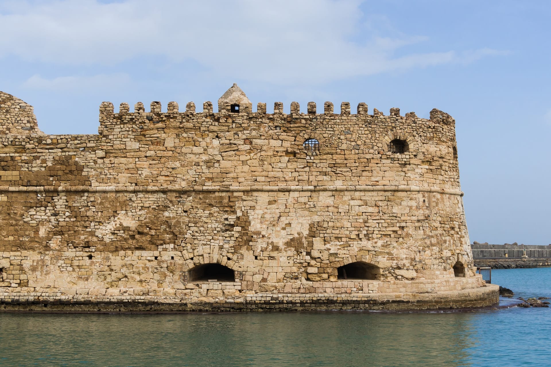 Detail of the eastern part of the venetian fortress (Koulès) at Harbour of Heraklion, Crete, Greece. The breakwater in background